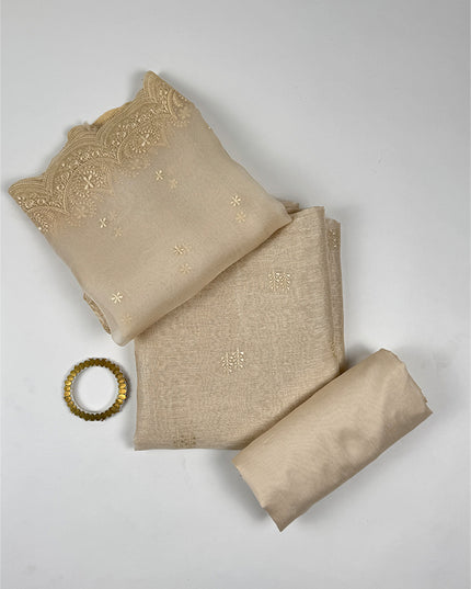 Sunehri shade Suit Set in tissue linen fabric with thread work